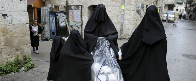 Ultra-Orthodox Jewish women known in Israel as 'Neshot Ha Shalim' cover themselves completely in a burqa-like, head-to-toe black cloth
