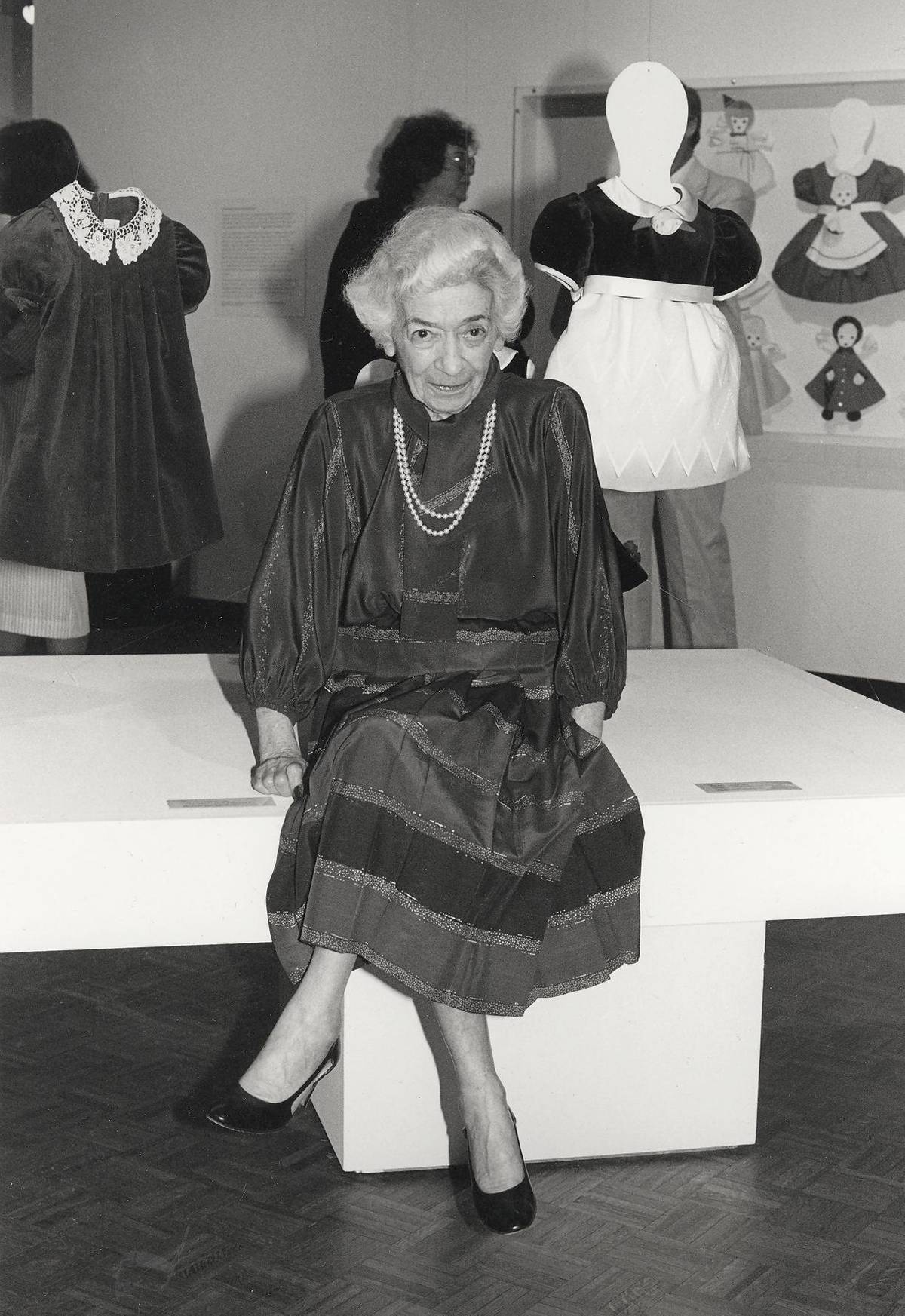 Florence Eiseman with some of her designs at a retrospective at the Milwaukee Art Museum in 1985. (Photo courtesy of FlorenceEiseman.com)