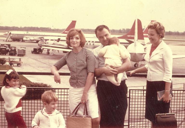 The author, at far left, with her parents and brothers (her mother is at center) and a cousin, at right, at Michigan Airport in the 1960s