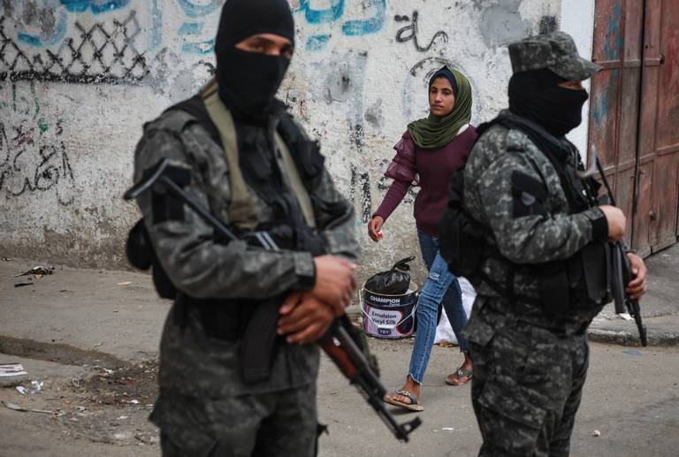 Islamic Jihad militants stand guard following Israel-Hamas truce, in Gaza, May 21, 2021