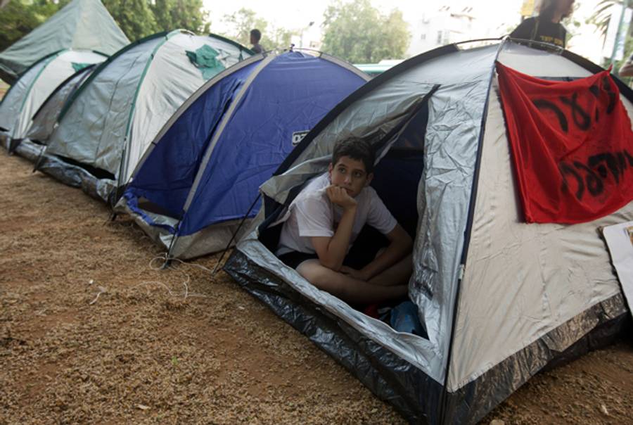 A young Israeli protester inside a tent in Tel Aviv on June 26, 2012.(Jack Guez/AFP/Getty Images)