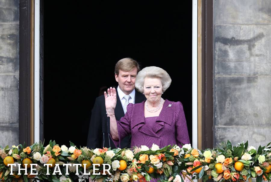 Princess Beatrix of The Netherlands appears with King Willem-Alexander on the balcony of the royal palace in Amsterdam to greet the public after her abdication on April 30, 2013.(Andreas Rentz/Getty Images)