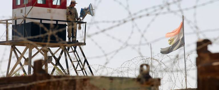 An Egyptian soldier mans a watchtower of the Rafah border crossing in the Gaza Strip, October 26, 2014. 