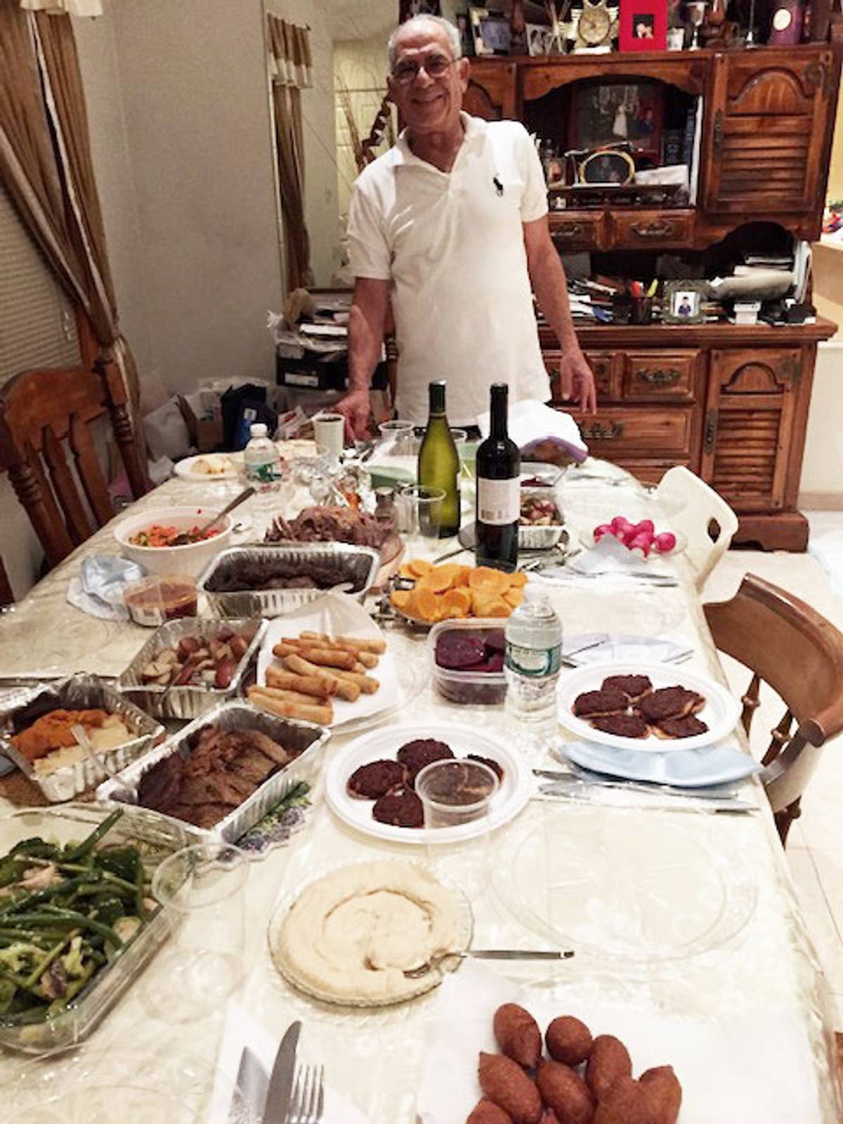 Dad on Rosh Hashanah, with all his homemade delicacies, including hummus