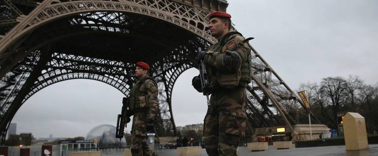 Armed security patrols around the Eiffel Tower in Paris, France, January 9, 2015. 