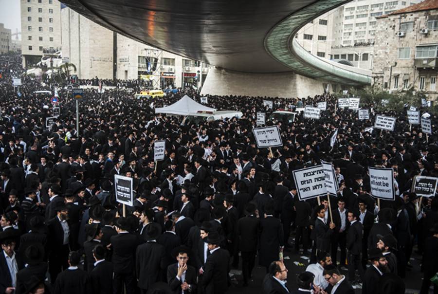 Ultra-Orthodox Jews take part in a mass prayer vigil in Jerusalem on March 2, 2014 in protest at plans to conscript young ultra-Orthodox men for Israeli military or civilian service. (DAVID BUIMOVITCH/AFP/Getty Images)