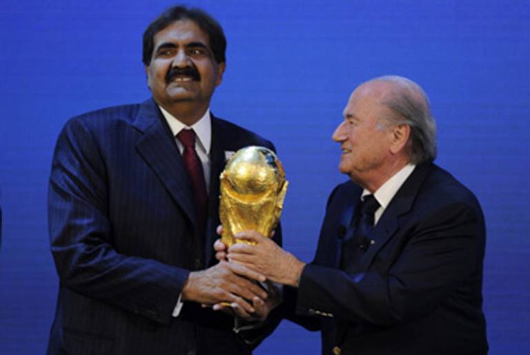 The Qatari emir and FIFA head Sepp Blatter.(Philippe Desmazes/AFP/Getty Images)