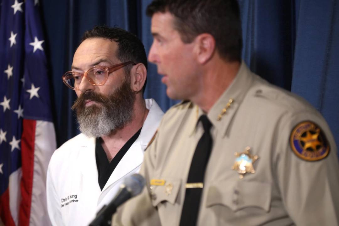 Christopher Young, Chief Medical Investigator for Ventura County, listens as Ventura County Sheriff Jim Fryhoff addresses the media regarding their investigation into the death of a 69-year-old Jewish man, Paul Kessler, during dueling Israel-Hamas war protests Sunday in Thousand Oaks on November 7, 2023