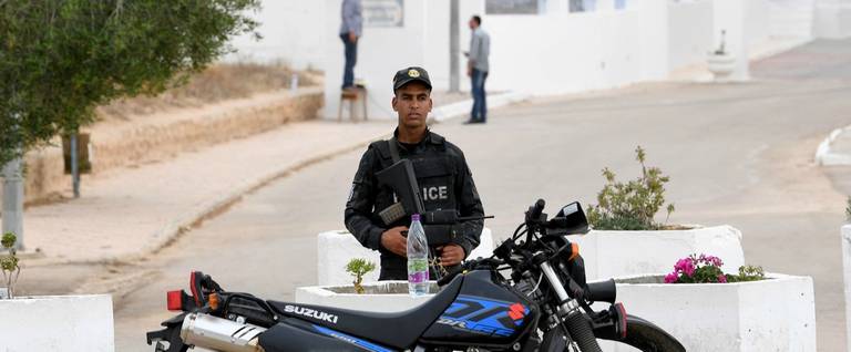 A policeman stands guard outside the El Ghriba synagogue in Djerba, Tunisia.