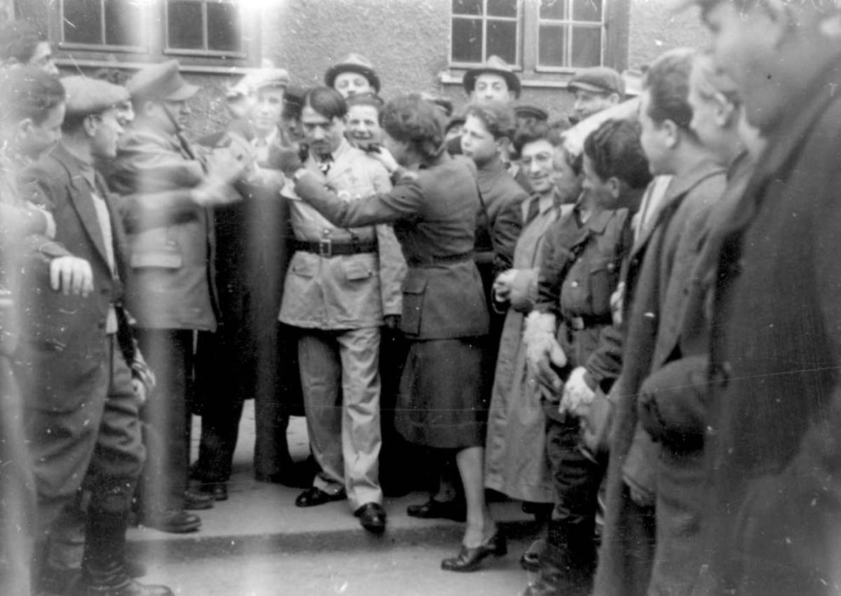 A Hitler impersonator during Purim celebrations at a DP camp, undated