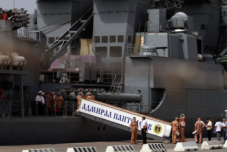 Members of Russian navy talk in front of the anti-aircraft ship Adm. Panteleyev moored during a port call on May 17, 2013, in Limassol, Cyprus.(Yiannis Kourtoglou/AFP/Getty Images)