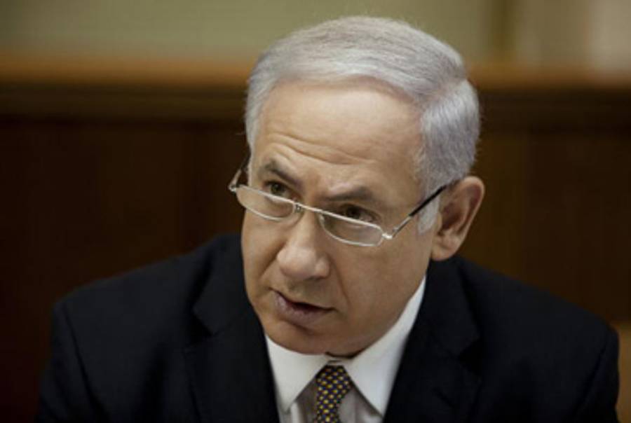 Shalom (L) huddles with Prime Minister Netanyahu Sunday.(Uriel Sinai/Getty Images)