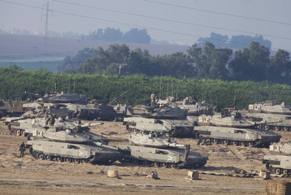 Israeli soldiers prepare their Tanks in a deployment area on July 9, 2014 on Israel's border with the Gaza Strip.(Lior Mizrahi/Getty Images)