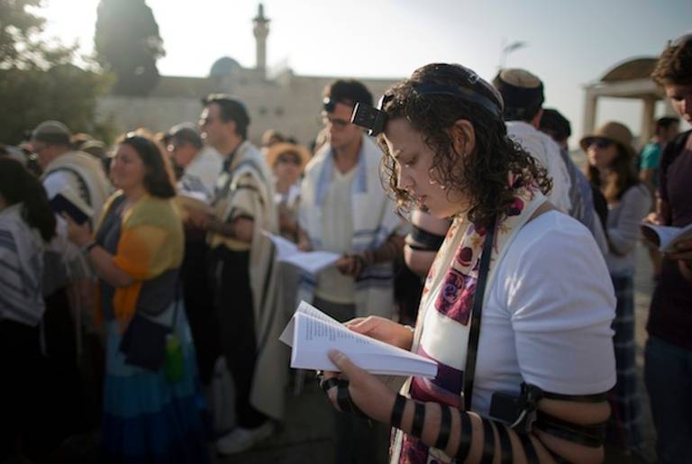 Members of Women of the Wall pray at the plaza near the Western Wall on July 8, 2013 marking the first day of the Jewish month of Av(MENAHEM KAHANA/AFP/Getty Images)