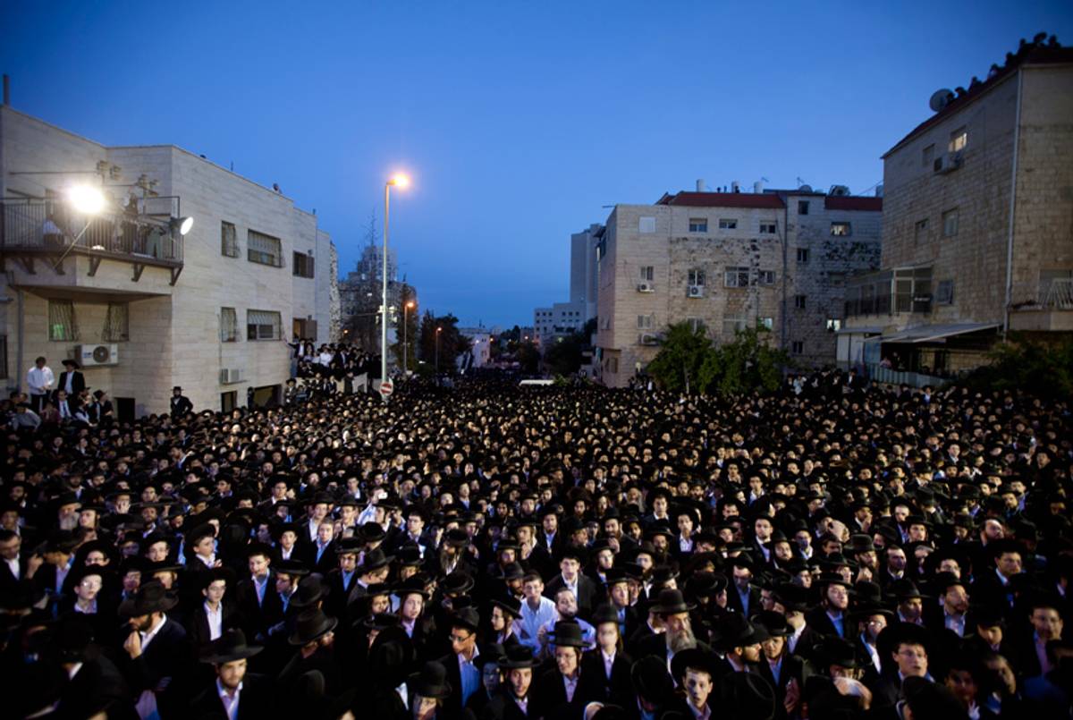 Ultra-Orthodox demonstrators confront police in Jerusalem on May 16, 2013, after gathering to protest against newly proposed government legislation that would see them drafted into the military.(Uriel Sinai/Getty Images)