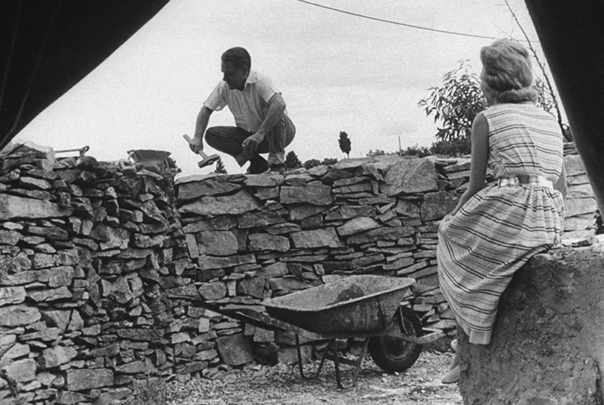 Lawrence Durrell building a stone wall, 1960, with his third wife, Claude-Marie Vincendon.(Loomis Dean/Time Life Pictures/Getty Images)