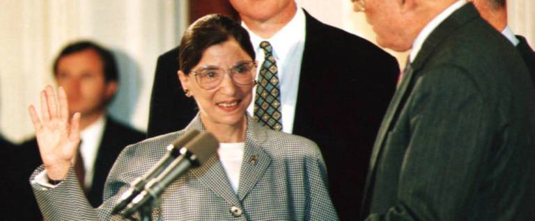 Chief Justice of the U.S. Supreme Court William Rehnquist (R) administers the oath of office to newly-appointed U.S. Supreme Court Justice Ruth Bader Ginsburg (L) as U.S. President Bill Clinton looks, Washington, D.C., August 10, 1993. 