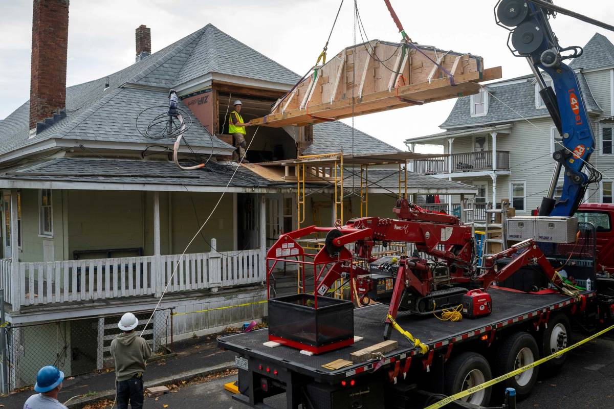 The 1,800-pound mural during its removal, a feat requiring structural engineering expertise