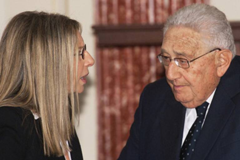 Barbra Streisand and Henry Kissinger, both invitees, speak yesterday at the State Department.(Paul J. Richards/AFP/Getty Images)