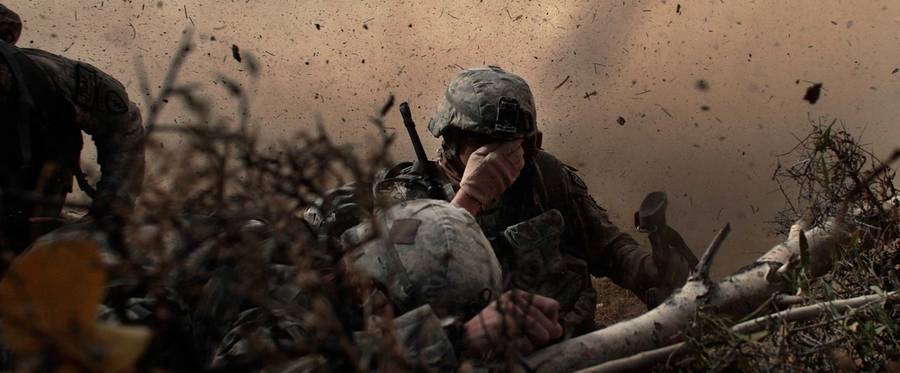 US Army soldiers in the 1/501st of the 25th Infantry Division shield their eyes from the powerful rotor wash of a Chinook cargo helicopter as they are picked up from a mission Oct. 15, 2009, in Paktika Province, Afghanistan