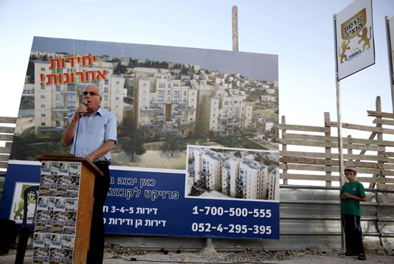 Israeli Housing Minister Uri Ariel, of the far-right Jewish Home party, speaks to the press during a promotion event for new housing units in the Jewish neighborhood of Armon Hanatsiv on August 11, 2013.(GALI TIBBON/AFP/Getty Images)