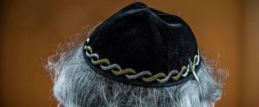 A Jewish man wears a kippa, or Jewish religious skull cap, during a meeting on 'the German and French perspectives on immigration, integration and identity' organized by the American Jewish Committee (AJC) on April 24, 2018 in Berlin.