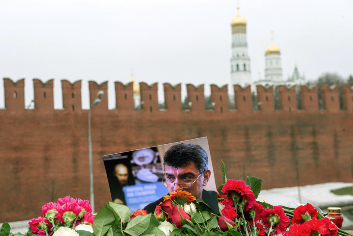 Pictures and flowers sit on Feb. 28, 2015, at the spot where Russian opposition leader Boris Nemtsov was shot dead, near Saint-Basil's Cathedral, in the center of Moscow.(Alexander Utkin/AFP/Getty Images)