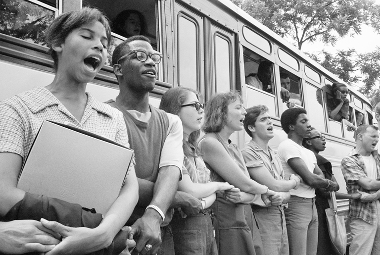 Student civil rights activists join hands and sing as they prepare to leave Ohio to register black voters in Mississippi during Freedom Summer 1964. (Ted Polumbaum/Newseum collection/PR Newswire)