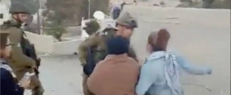 Ahed Tamimi and a friend assaulting IDF soldiers in Nebi Salah