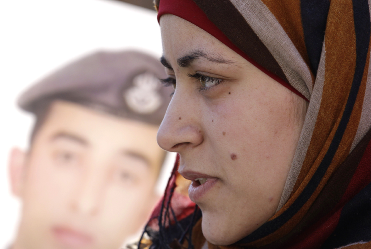 Anwar Tarawneh, the wife of Jordanian pilot Maaz al-Kassasbeh, takes part in a rally calling for the release of her captive husband in Amman on Feb. 3, 2015.(Khalil Mazraawi/AFP/Getty Images)