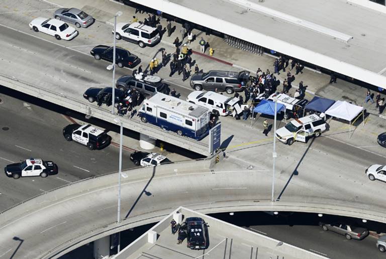 Law enforcement official gather at a command center on the upper level of Los Angeles International Airport after a shooting inside the airport's Terminal 3 November 1, 2013 in Los Angeles, California. (Kevork Djansezian/Getty Images)