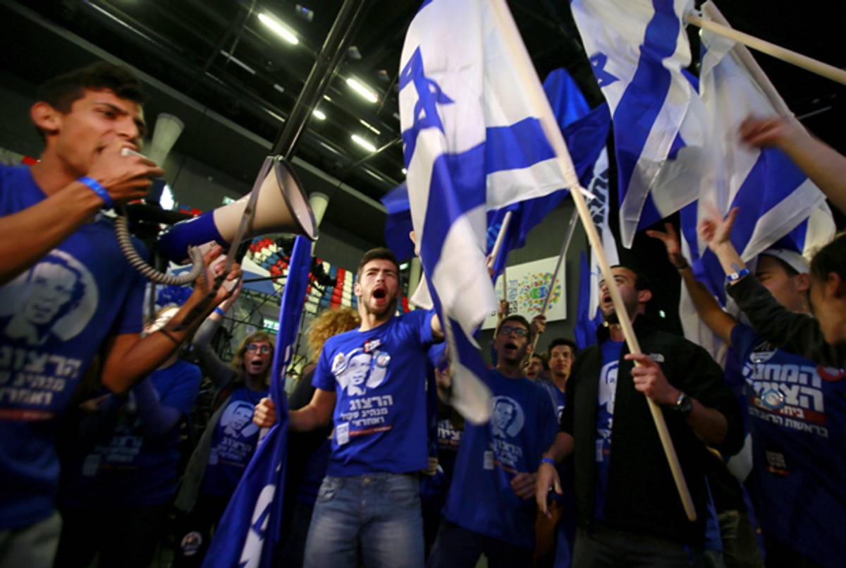 Supporters of the Zionist Union party react to preliminary election results on March 17, 2015 in Tel Aviv, Israel. (Ilia Yefimovich/Getty Images)