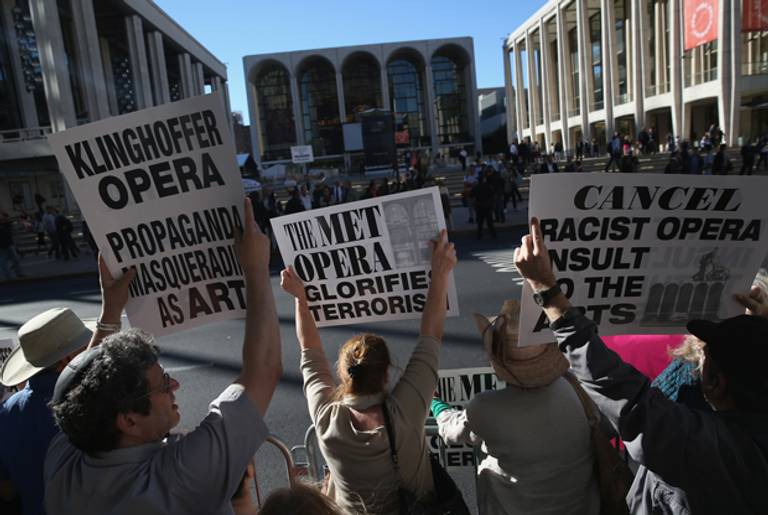 Protesters demonstrate as people arrive for the opening night of the Metropolitan Opera season at Lincoln Center on September 22, 2014 in New York City. (John Moore/Getty Images)