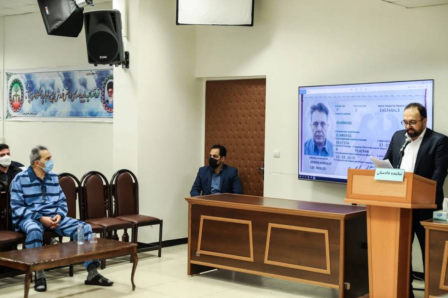 Jamshid Sharmahd, at left, who is accused by the Iranian government of being a leader of the U.S.-based ‘Tondar terrorist group’ behind a deadly attack in Iran in 2008, attends the first hearing of his trial in Tehran on Feb. 6, 2022