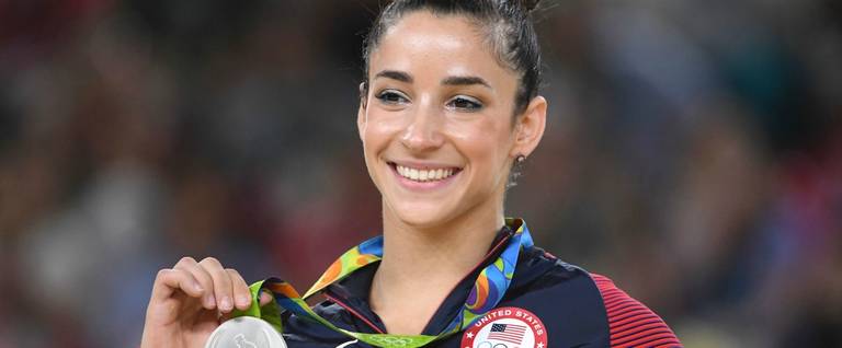 Alexandra Raisman celebrates on the podium of the women's floor event final of the Artistic Gymnastics at the Olympic Arena during the Rio 2016 Olympic Games in Rio de Janeiro, Brazil, August 16, 2016. 