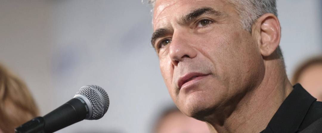 Israeli MP and chairperson of center-right Yesh Atid party, Yair Lapid, delivers a speech (a speech different to the one included in this article) to launch his party's platform during a press conference in Tel Aviv on March 2, 2015 ahead of the March 17 general elections. 