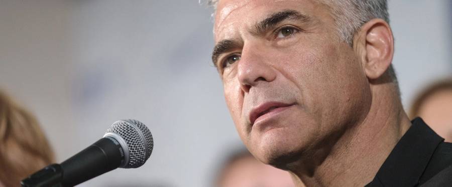 Israeli MP and chairperson of center-right Yesh Atid party, Yair Lapid, delivers a speech (a speech different to the one included in this article) to launch his party's platform during a press conference in Tel Aviv on March 2, 2015 ahead of the March 17 general elections. 