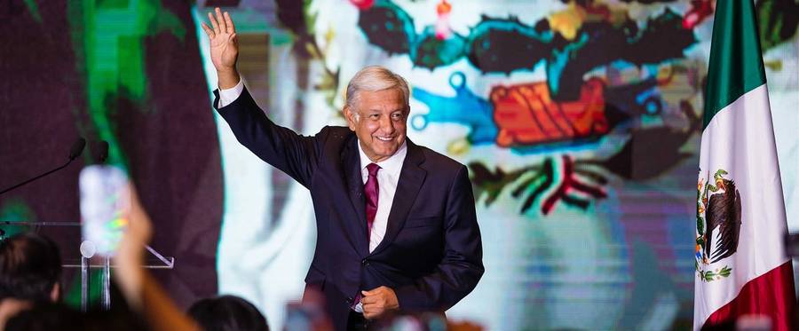 Andrés Manuel López Obrador salutes attendees after his virtual victory in the elections for the Presidency of Mexico in the Media Center at the Hilton Hotel on July 1, 2018 in Mexico City, Mexico.