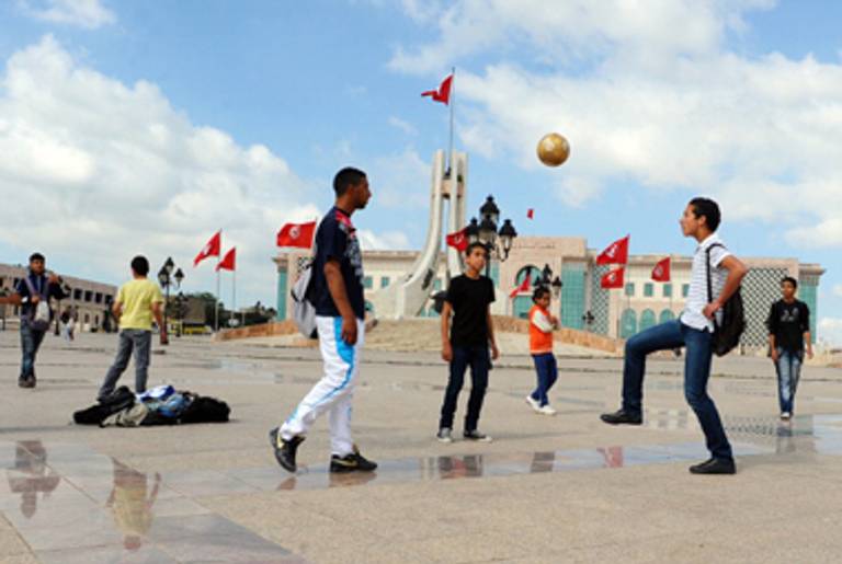 Tunisian youths play football on May 4, 2011 in the Kasbah square in Tunis.(Fethi Belaid/AFP/Getty Images)