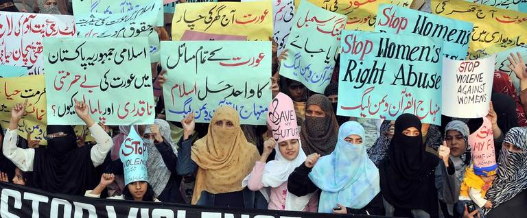 Supporters of Tehrik-e-Minhaj ul Quran, an Islamic Organisation protest against 'honour killings' of women in Lahore on November 21, 2008. Human rights lawyer Zia Awan said that more than 62,000 cases of women abused in Pakistan since the year 2000 and 159 women died in honour killings in the year to September 30.
