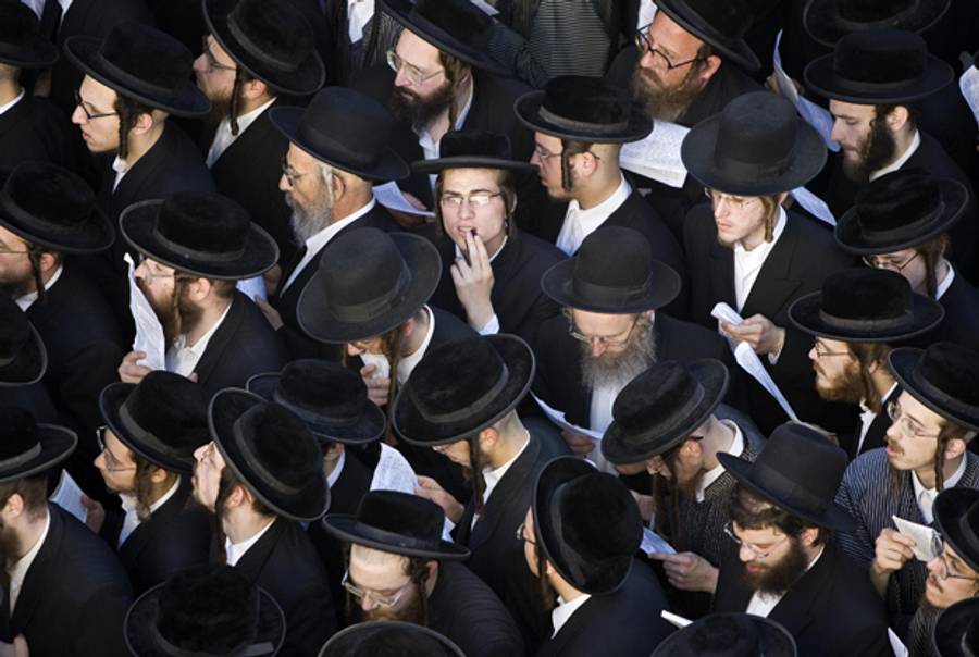 Thousands of ultra-Orthodox Jewish protesters pray in Jerusalem's neighborhood of Mea Shearim on July 8, 2009. (Jonathan Nackstrand/AFP/Getty Images)