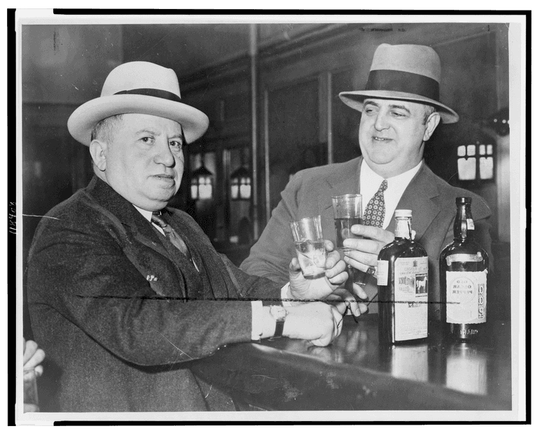 Izzy Einstein, left, sharing a toast with Moe Smith, New York, 1935