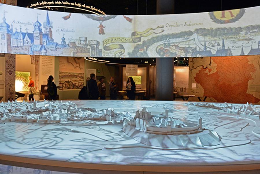 Visitors view an exhibit in the Museum of the History of Polish Jews in Warsaw on October 21, 2014. (JANEK SKARZYNSKI/AFP/Getty Images)
