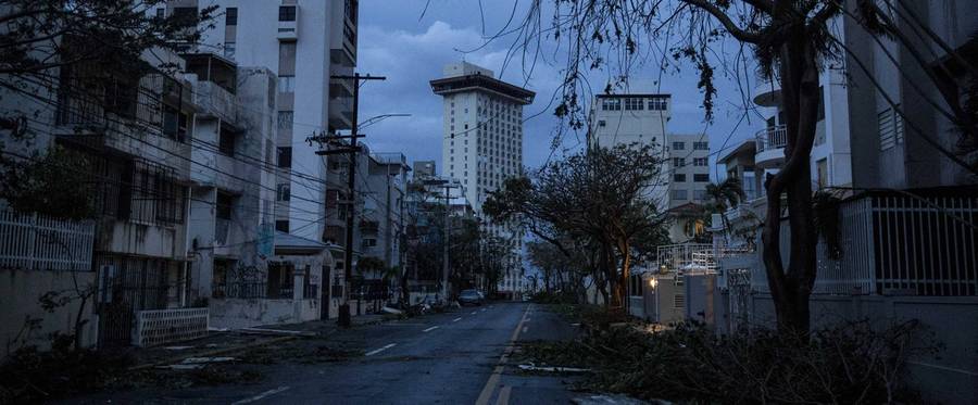 The Miramar neighborhood is completely dark during a blackout after Hurricane Maria made landfall on Sept. 20, 2017, in San Juan, Puerto Rico. Thousands of people have sought refuge in shelters, and electricity and phone lines have been severely affected.