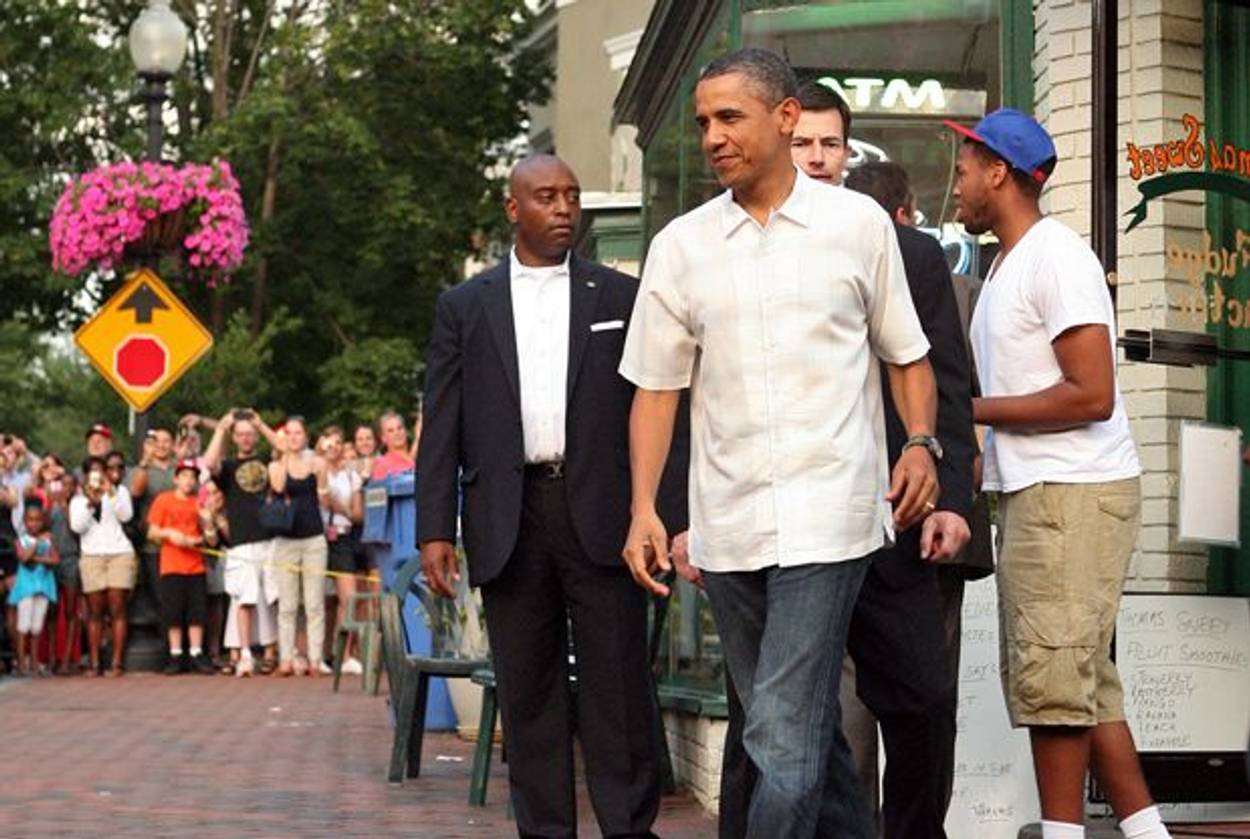 President Barack Obama departs the Thomas Sweet ice cream parlour with his daughter, Malia on June 19, 2011, Father’s Day. (Martin H. Simon-Pool/Getty Images)