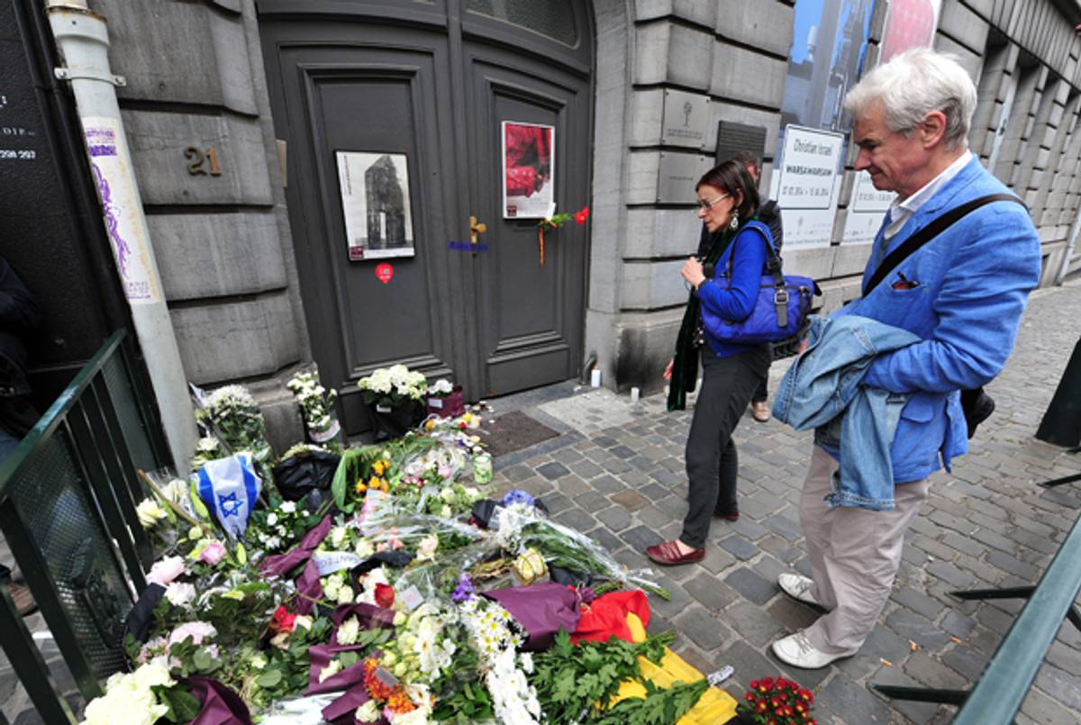 People pay their respects in front of a makeshift memorial at the entrance of the Jewish Museum in Brussels, on May 25, 2014, where a deadly shooting took place the day before. (GEORGES GOBET/AFP/Getty Images)