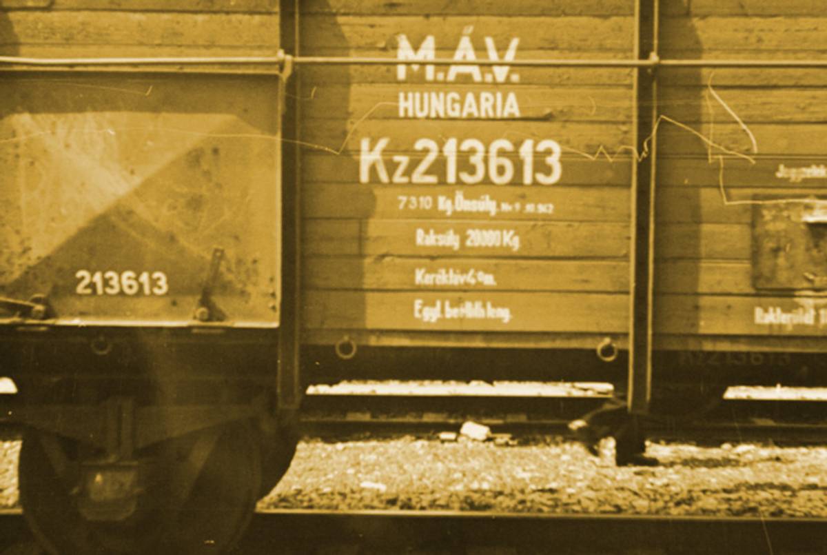 View of the "MAV Hungaria" (Magyar Allam Vasutak, Hungarian State Railway) identification printed on the side of one of the freight cars of the Hungarian Gold Train in Werfen, Austria, 1945.(Photo treatment Tablet Magazine; original photo United States Holocaust Memorial Museum, courtesy of National Archives and Records Administration, College Park.)