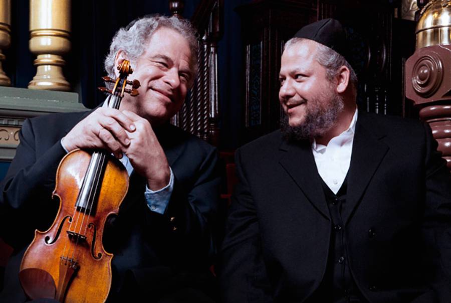 Itzhak Perlman and Yitzhak Meir Helfgot, cantor of the Park East Synagogue.(Lisa-Marie Mazzucco)