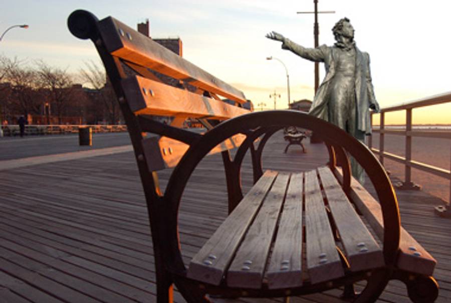 A St. Petersberg statue of Alexander Pushkin reset on the boardwalk of Brooklyn'n Brighton Beach.(Collage: Abigail Miller/Tablet Magazine. Brighton Beach Park Bench by lorna; some rights reserved. Puskin Monument by George Shuklin; some rights reserved.)