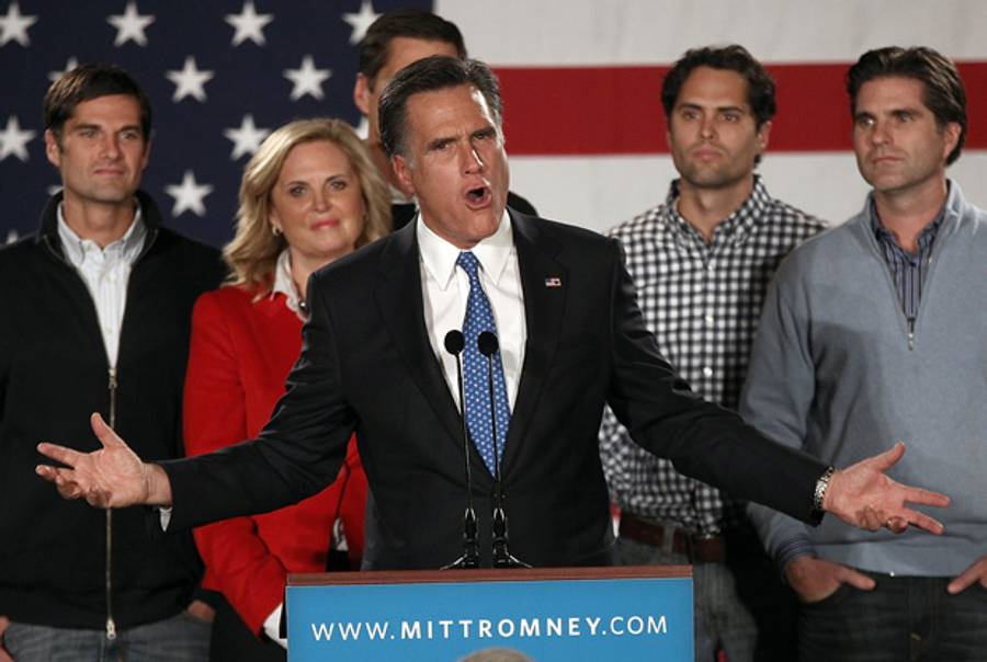 Mitt Romney, flanked by family, gives a quasi-victory speech last night.(Win McNamee/Getty Images)
